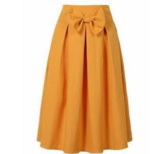 Yellow mustard poly skirt, bow, below knee length